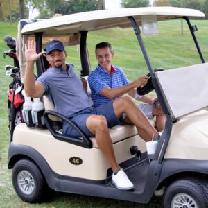 Two men in golf cart
